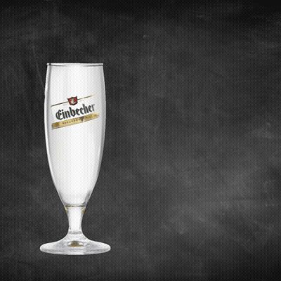 A Glass Of Einbecher Sits On A Blackboard GIF