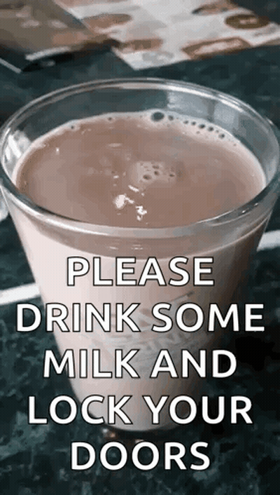 A Glass Of Milk Is On A Table With A Sign That Says Please Drink Some Milk And Lock Your Doors . GIF