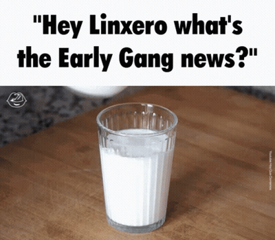 A Glass Of Milk Sits On A Wooden Counter With The Caption " Hey Linxero What 'S The Early Gang News ? " GIF