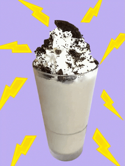 A Glass Of Milkshake With Whipped Cream And Oreos On Top GIF