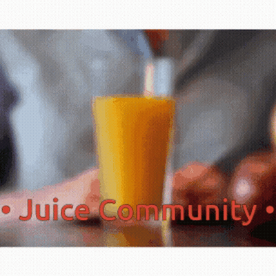 A Glass Of Orange Juice Is Being Poured Into A Glass With The Words Juice Community Below It GIF