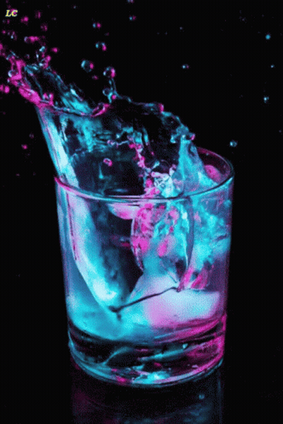 A Glass Of Water With A Splash And The Letter Lc In The Corner GIF