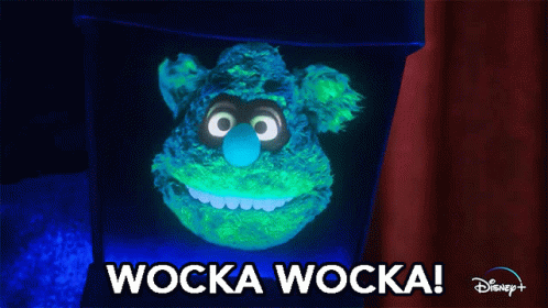 A Glow In The Dark Stuffed Animal With The Words Wocka Wocka On The Bottom GIF