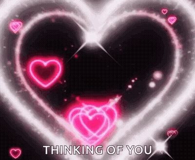 A Glowing Heart With The Words `` Thinking Of You '' In The Middle . GIF