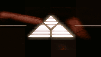 A Glowing Triangle With A Red Background GIF