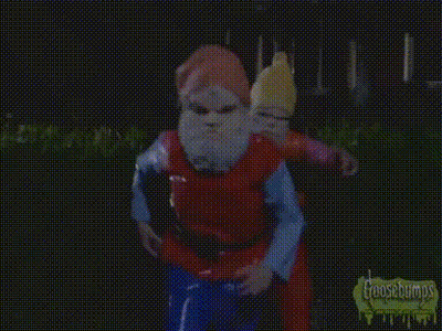 A Gnome With A Red Hat And White Beard Is Wearing A Yellow Shirt . GIF
