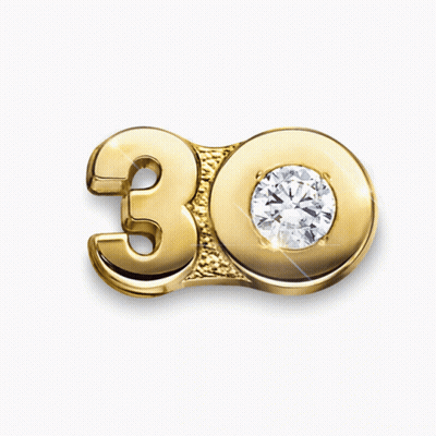 A Gold Number 30 With A Diamond On It GIF