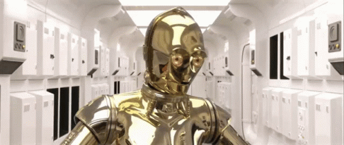 A Gold Robot Is Standing In A Hallway With A Few Lockers GIF