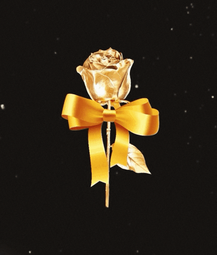 A Gold Rose With A Yellow Ribbon On It GIF