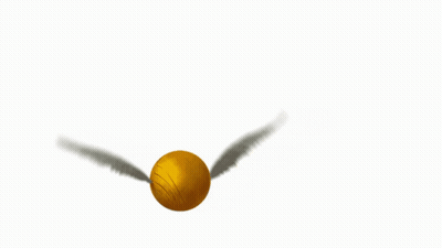 A Golden Snitch Is Flying In The Air With Wings GIF