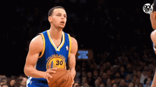 A Golden State Warriors Basketball Player Is About To Shoot A Basketball GIF
