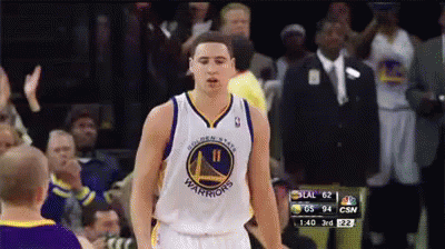 A Golden State Warriors Basketball Player Stands In Front Of The Crowd GIF