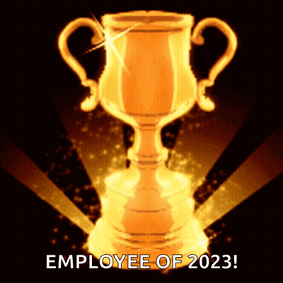 A Golden Trophy That Says Employee Of 2023 On The Bottom GIF