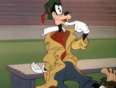 A Goofy Cartoon Character Is Sitting On A Bench With His Hand In His Mouth GIF