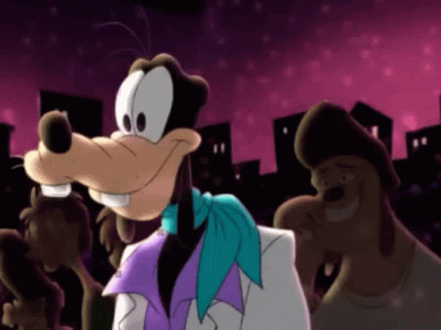 A Goofy Cartoon Character Wearing A Purple Scarf And A White Jacket GIF