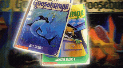 A Goosebumps Book Titled Deep Trouble Sits Next To Another Book Titled Monster Blood Ii GIF