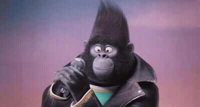 A Gorilla Singing Into A Microphone Wearing A Black Leather Jacket GIF