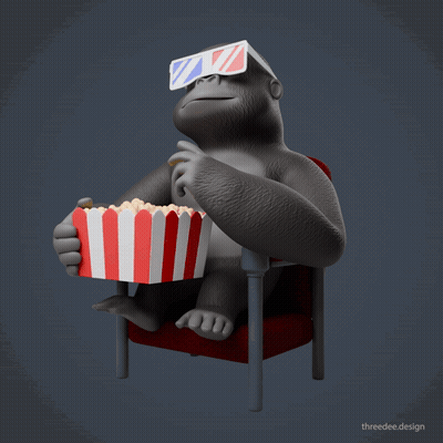 A Gorilla Wearing 3D Glasses Is Sitting In A Red Chair Eating Popcorn GIF