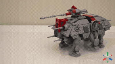 A Gray And Red Lego Robot With A Star Wars Logo On The Side GIF