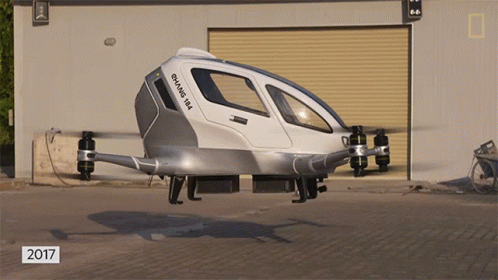 A Gray And White Flying Vehicle With The Year 2017 On The Bottom Right GIF