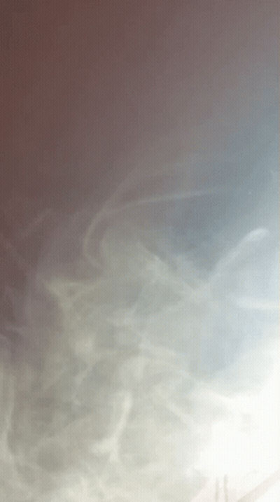 A Gray Background With A Few Lines Of Smoke On It GIF
