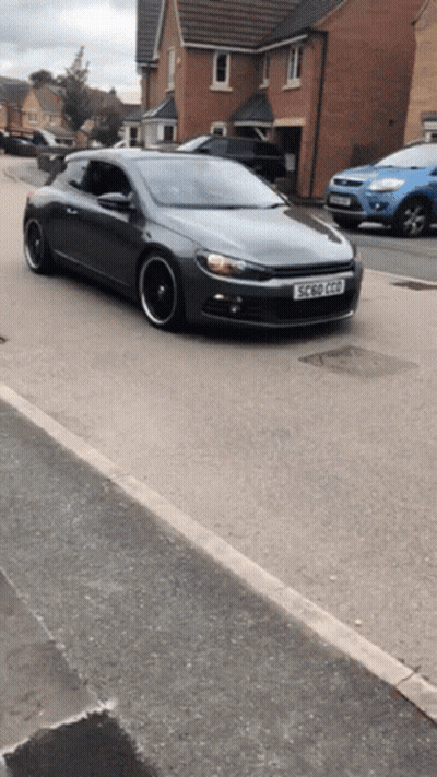 A Gray Car With A License Plate That Says Ec 50 Gpd GIF