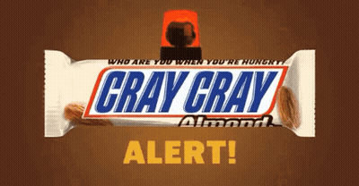 A Gray Gray Almond Snickers Bar With A Red Light On Top GIF