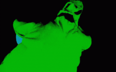 A Green And Black Image Of A Person 'S Face With A Blue Light Coming Out Of It GIF