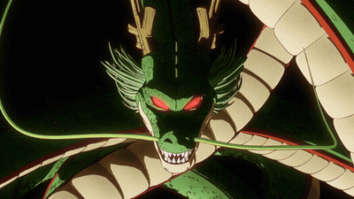 A Green And White Dragon With Red Eyes GIF