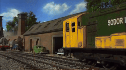 A Green And Yellow Train With Sodor Written On The Side GIF