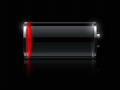 A Green Battery Is Glowing In The Dark On A Black Surface GIF