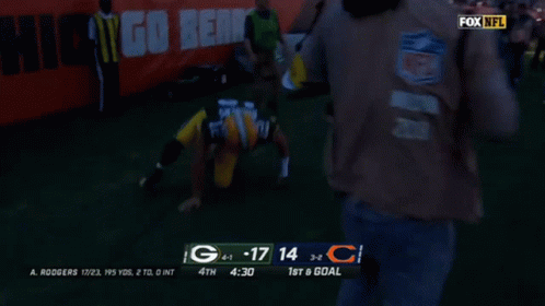 A Green Bay Packers Football Player Celebrates A Touchdown GIF