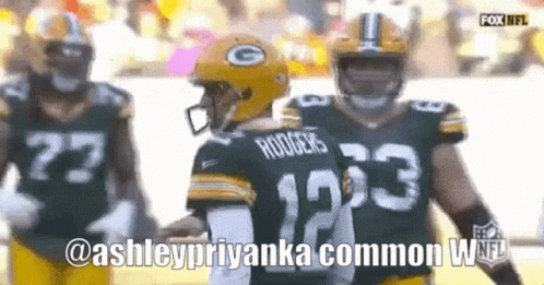 A Green Bay Packers Player Named Rodgers Is Shaking Hands With Another Player GIF