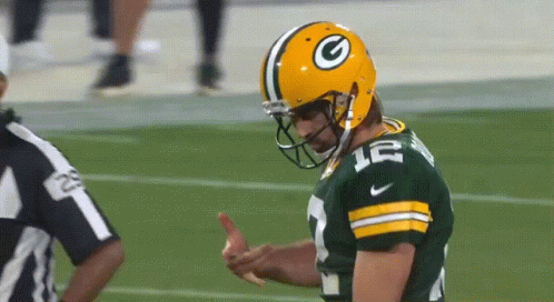 A Green Bay Packers Player Wearing A Helmet With A G On It GIF
