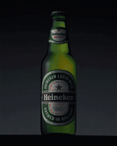 A Green Bottle Of Heineken Lager Beer Brewed In Holland GIF