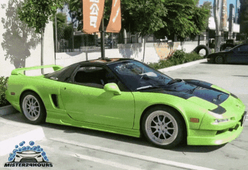 A Green Car Is Parked In A Parking Lot With A Mister24hours Logo In The Corner GIF