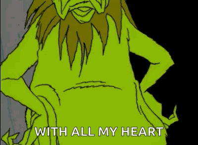 A Green Cartoon Character Is Holding A Picture Frame With A Heart Drawn On It And The Words With All My Heart Below It GIF