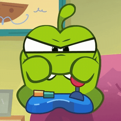 A Green Cartoon Character Is Playing A Video Game With A Controller GIF