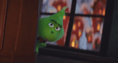 A Green Cartoon Character Is Standing In Front Of A Window Looking Out . GIF
