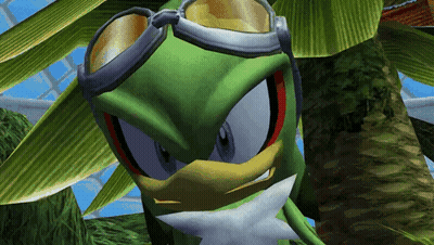 A Green Cartoon Character Wearing Goggles Is Looking At The Camera GIF