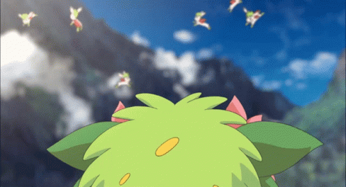 A Green Cartoon Character With A Pink Bow On Its Head Looks Up At The Sky GIF