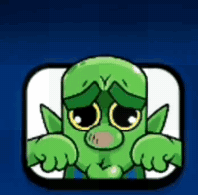 A Green Cartoon Character With A Sad Look On His Face Is Sitting In A Square . GIF