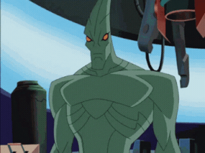 A Green Cartoon Character With Red Eyes And A Pointed Head GIF