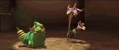 A Green Caterpillar Is Standing Next To A Small Bug GIF