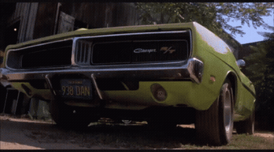 A Green Dodge Charger With A California License Plate GIF