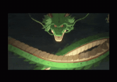 A Green Dragon With A Very Long Tail Is Flying In The Dark GIF