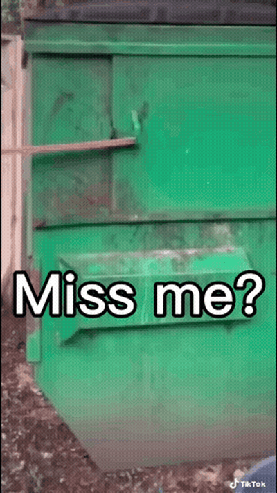 A Green Dumpster With The Words " Miss Me " Written On It GIF