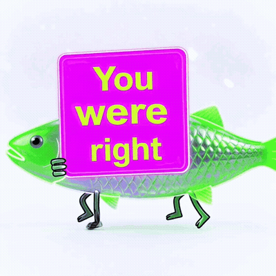 A Green Fish Holding A Pink Sign That Says You Were Right GIF