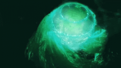 A Green Glowing Object In The Dark GIF