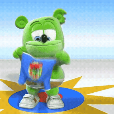 A Green Gummy Bear Is Holding A Blue Shirt That Says ' Gummy Bear ' On It GIF